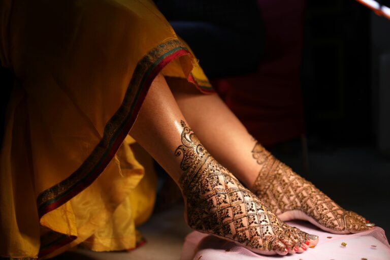Close-up shot of traditional bridal henna on feet, showcasing intricate Indian wedding designs and cultural beauty.